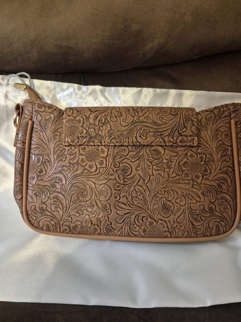 Women’s Tan Crossbody Bag with Tooled Floral Design and Western Concho